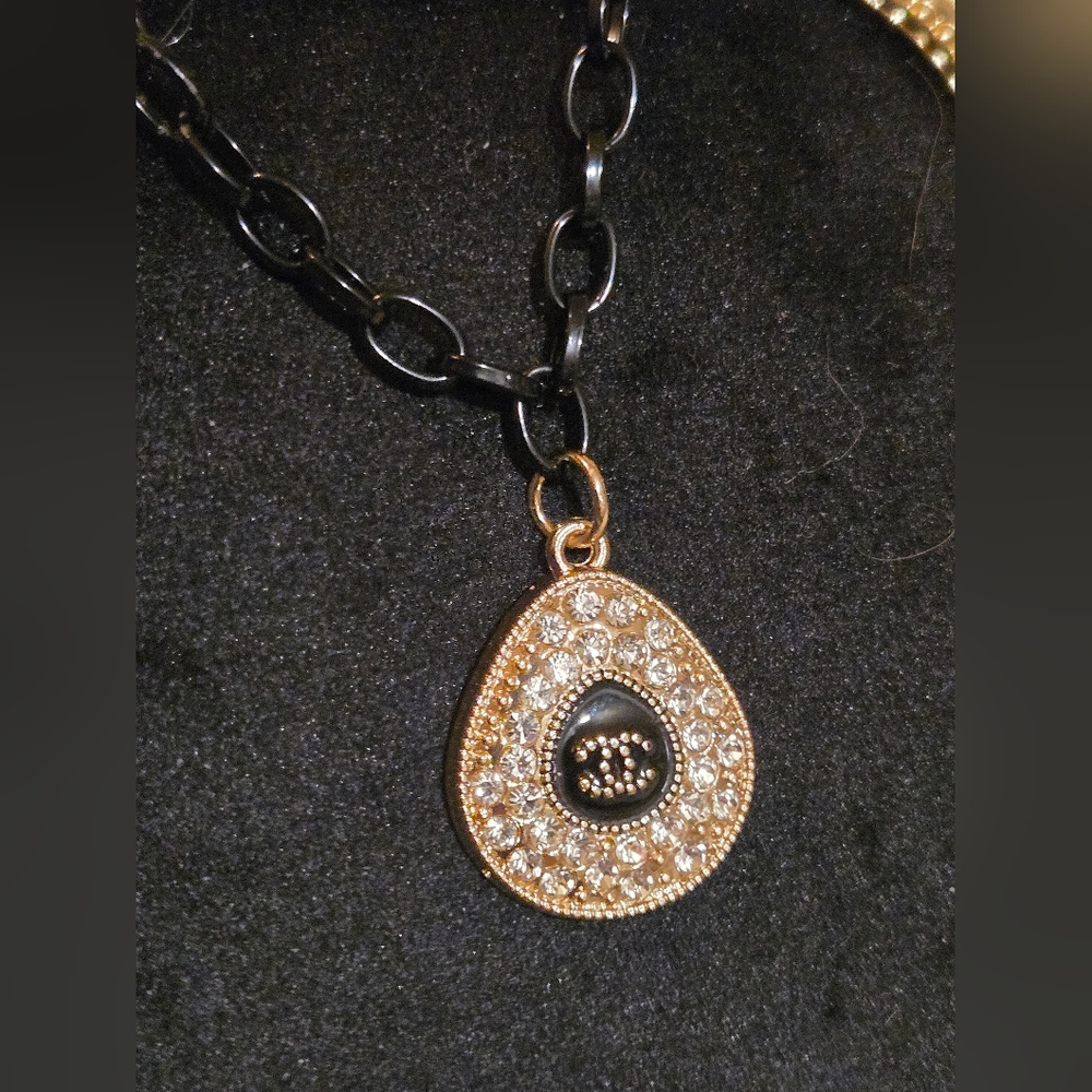 Elegant Gold and Black Teardrop Iconic Logo Pendant Necklace